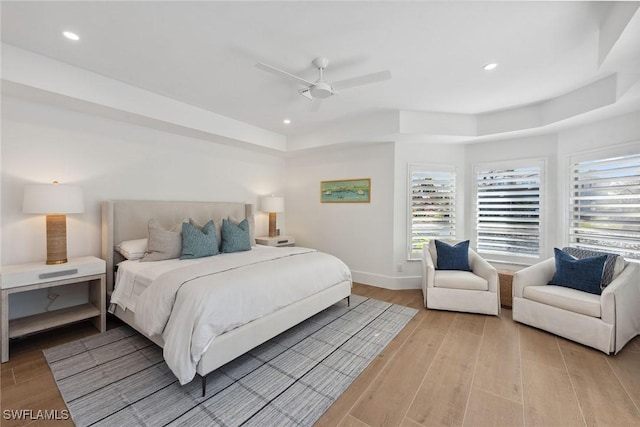 bedroom featuring light wood-style flooring, baseboards, and recessed lighting