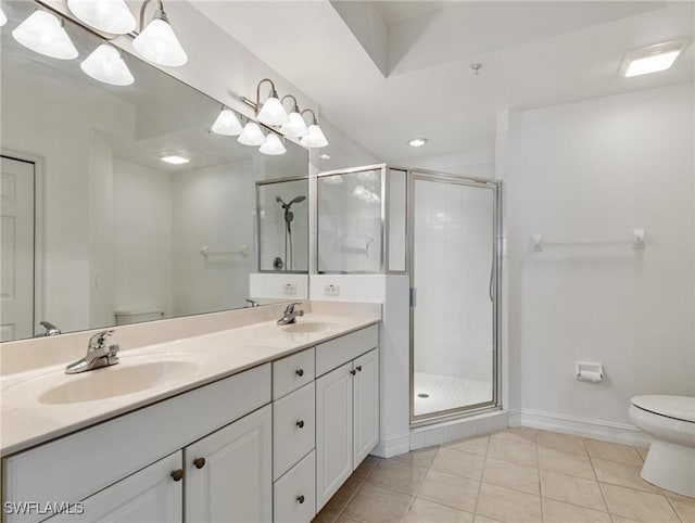 bathroom featuring toilet, a shower with door, tile patterned floors, vanity, and an inviting chandelier