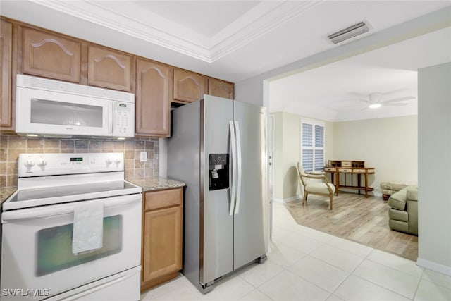 kitchen featuring backsplash, light tile patterned floors, ceiling fan, crown molding, and white appliances