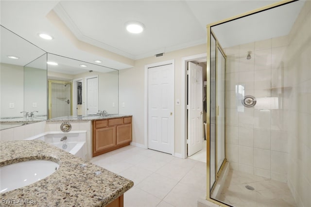 bathroom with independent shower and bath, ornamental molding, tile patterned flooring, and vanity