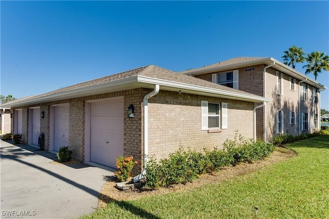 view of side of property with a lawn