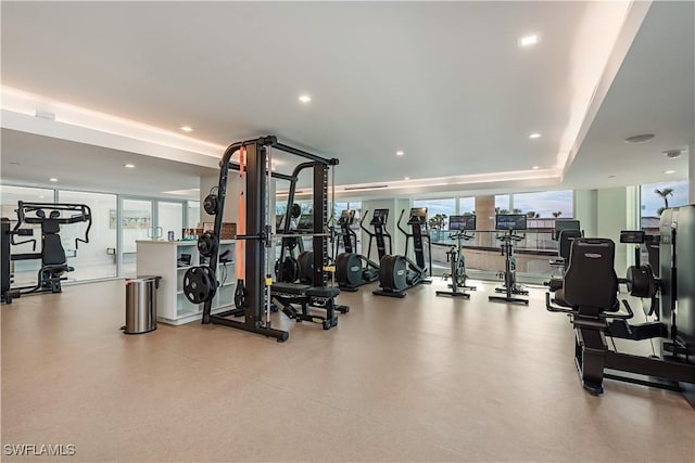 workout area with a wall of windows