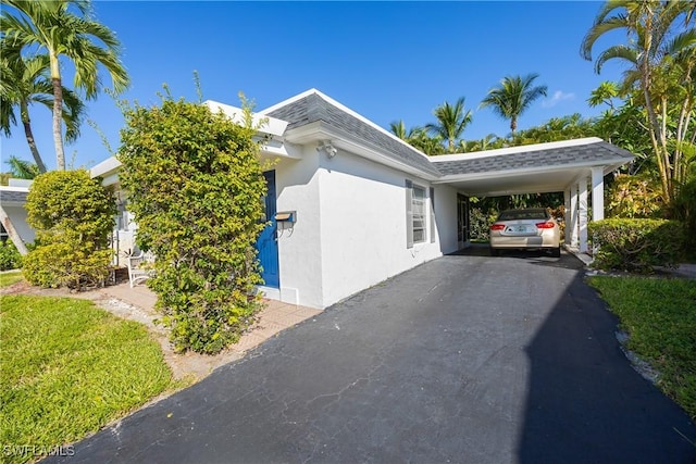 view of home's exterior with a carport