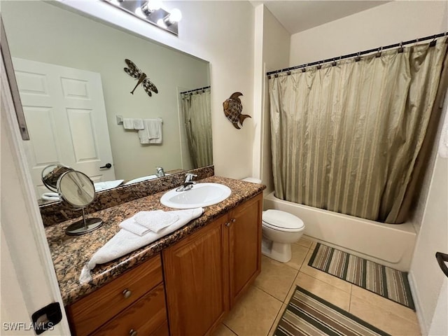 full bath featuring tile patterned flooring, shower / tub combo with curtain, vanity, and toilet