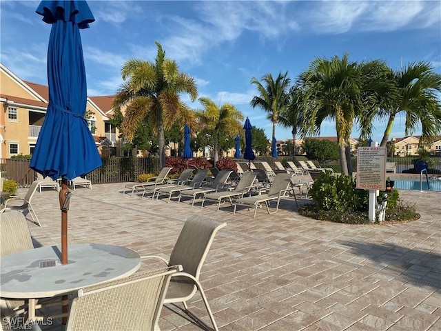 exterior space featuring a patio area and fence