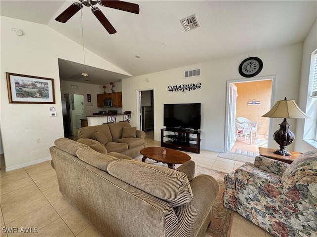 living area with a ceiling fan, light tile patterned flooring, lofted ceiling, and visible vents