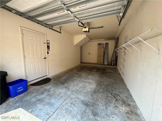 garage featuring a garage door opener