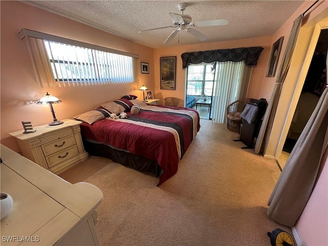 bedroom with light carpet, a textured ceiling, and access to exterior
