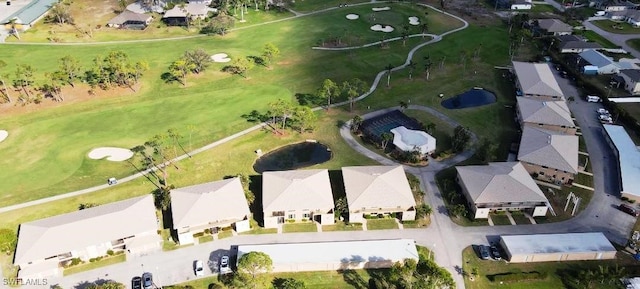 bird's eye view with view of golf course and a residential view