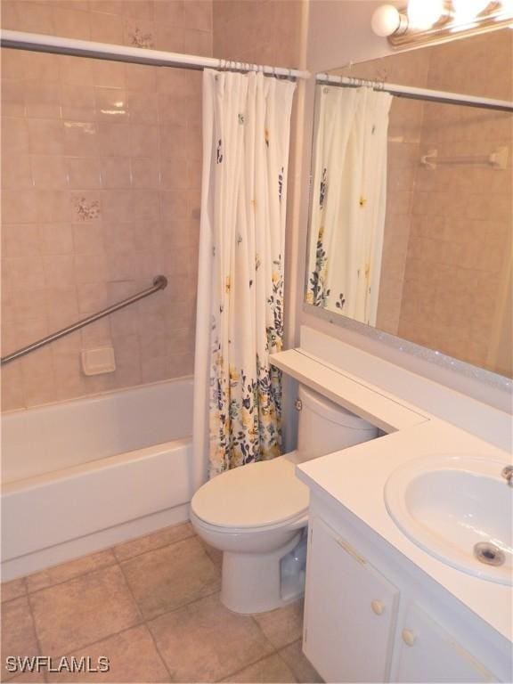 full bathroom featuring tile patterned floors, vanity, toilet, and shower / bath combo with shower curtain