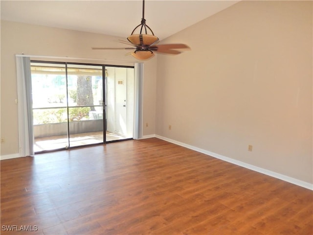 spare room with wood-type flooring, lofted ceiling, and ceiling fan