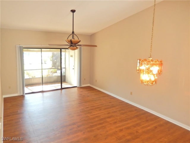 unfurnished room with hardwood / wood-style floors and a chandelier