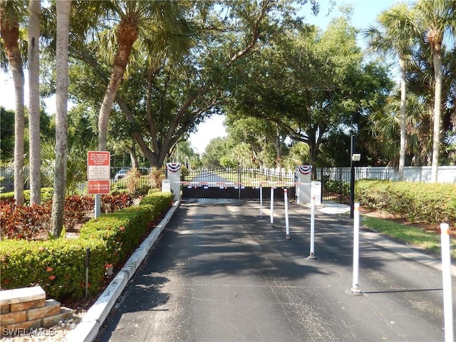 view of street featuring a gate and a gated entry