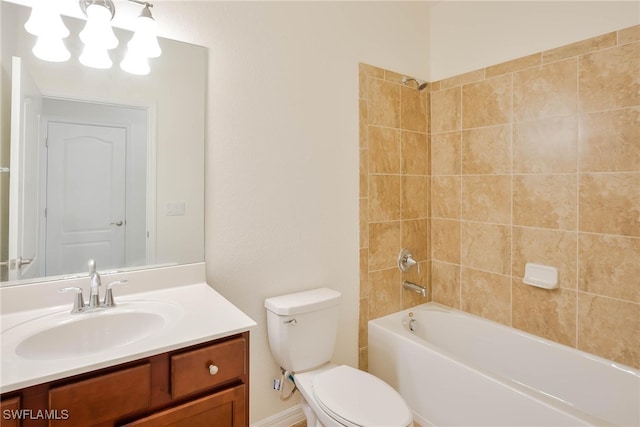 full bathroom with vanity, toilet, and tiled shower / bath combo