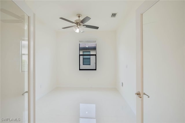 unfurnished room with ceiling fan, plenty of natural light, and light tile patterned floors