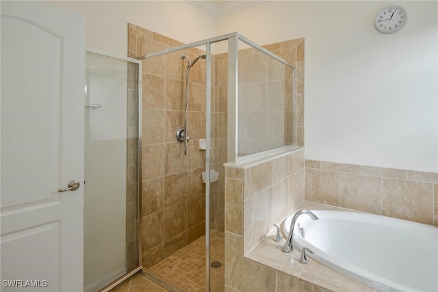 bathroom featuring shower with separate bathtub