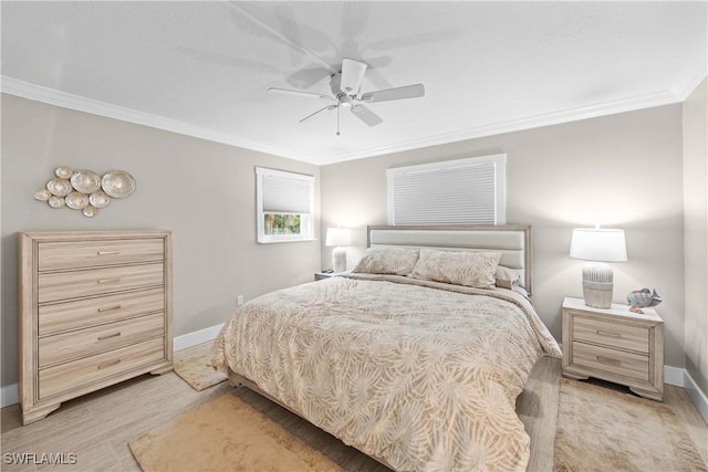 bedroom with crown molding, ceiling fan, and light hardwood / wood-style flooring