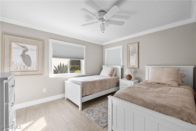 bedroom featuring ornamental molding, ceiling fan, and light wood-type flooring