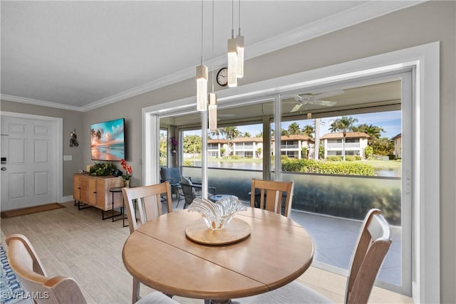 tiled dining area featuring ornamental molding