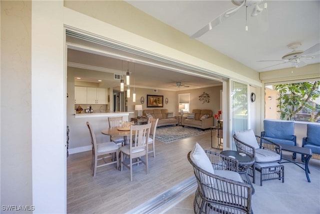 dining room featuring ceiling fan