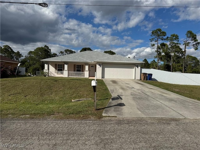 single story home featuring stucco siding, a front yard, fence, a garage, and driveway