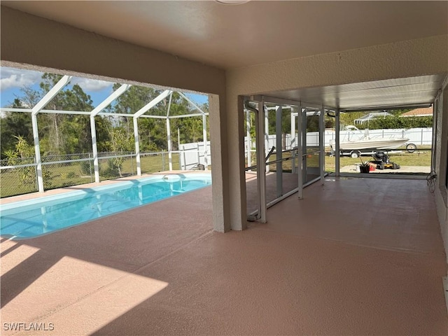 view of swimming pool featuring a patio area, a fenced backyard, a fenced in pool, and a lanai