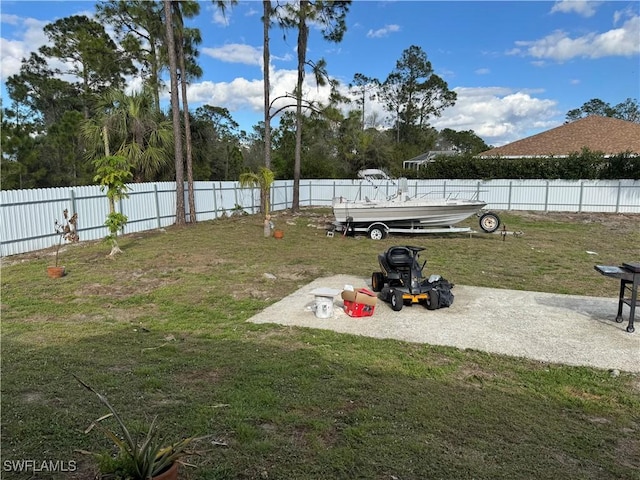 view of yard with a fenced backyard