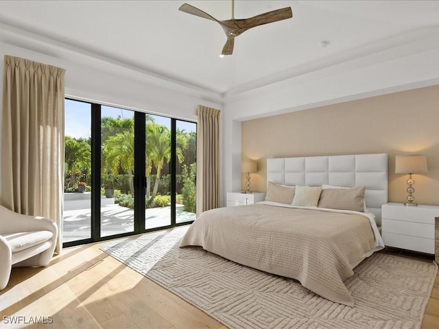 bedroom with ceiling fan, light hardwood / wood-style flooring, and access to outside