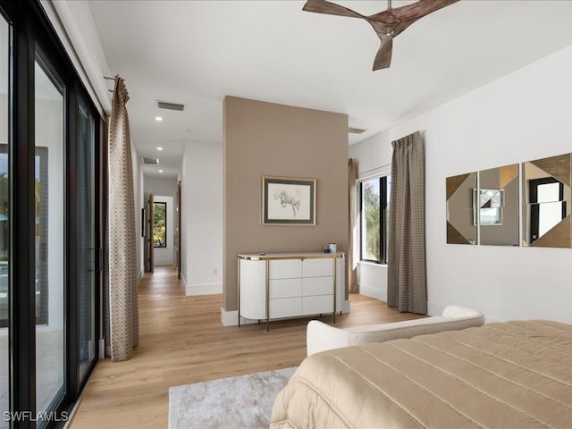 bedroom featuring light hardwood / wood-style flooring and ceiling fan