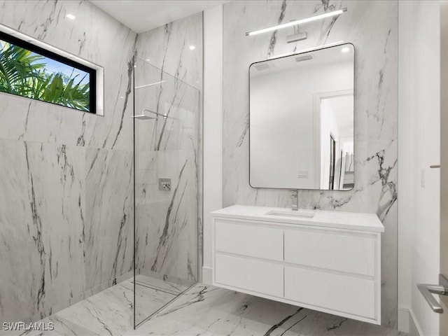 bathroom with vanity and a tile shower