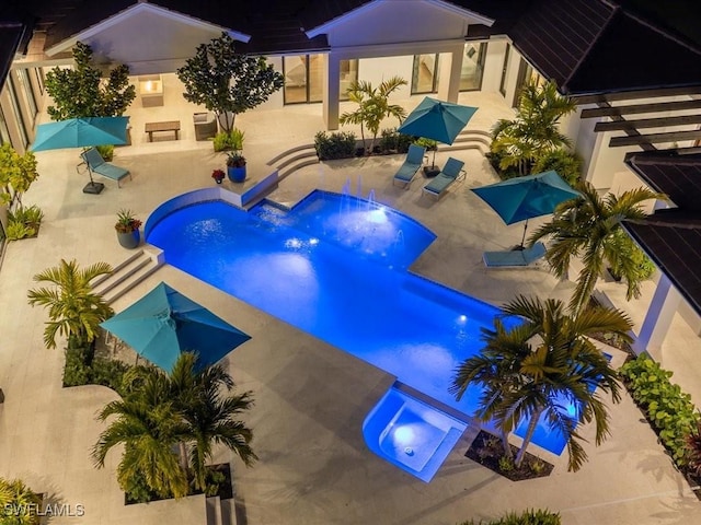 view of swimming pool with an in ground hot tub and a patio area