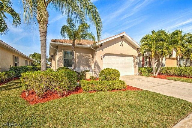 view of front of house with a garage and a front lawn