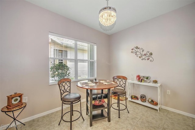 dining space featuring an inviting chandelier and light tile patterned floors