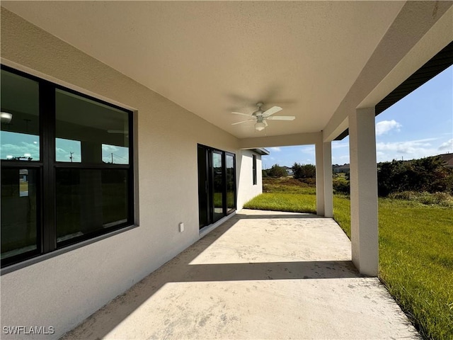 view of patio / terrace featuring ceiling fan