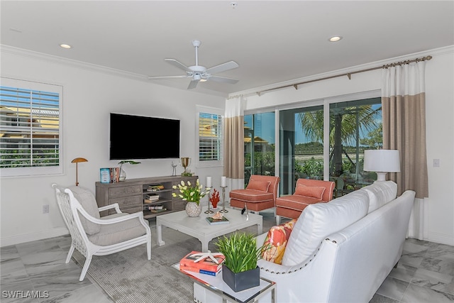 living room with crown molding and ceiling fan