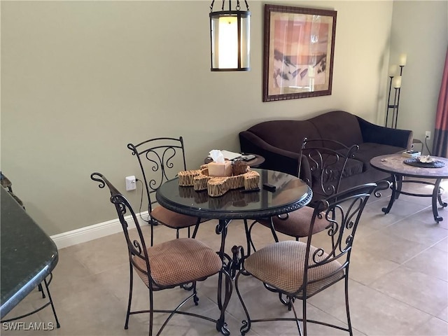 dining area with light tile patterned floors