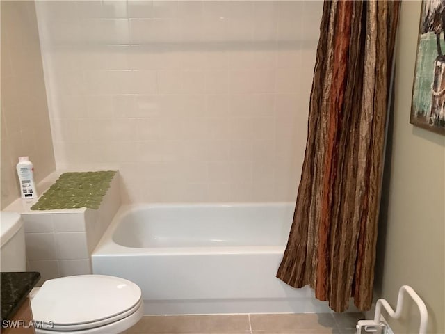 bathroom with tile patterned floors and toilet