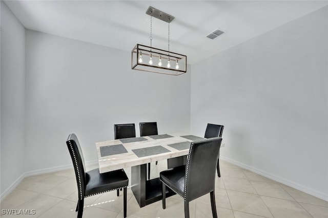 dining space featuring light tile patterned floors