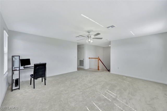 office area featuring ceiling fan and light colored carpet