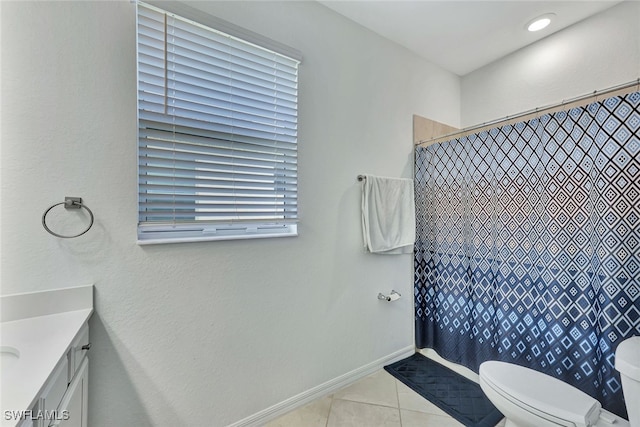 bathroom with a shower with shower curtain, vanity, toilet, and tile patterned flooring