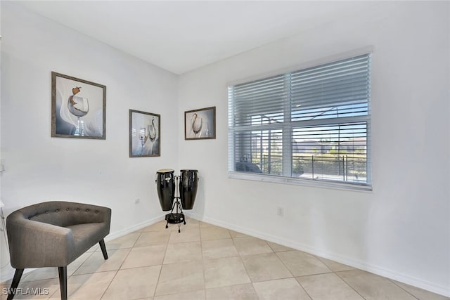 living area featuring light tile patterned flooring