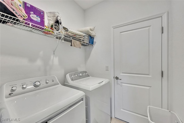 laundry area with washer and clothes dryer