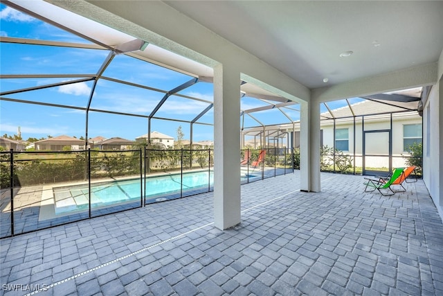 view of patio / terrace featuring glass enclosure