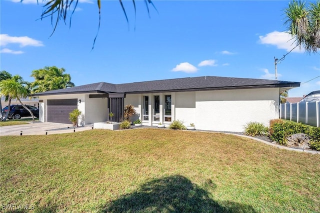 single story home with a garage and a front lawn