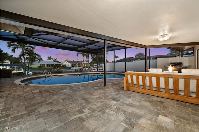 view of pool at dusk