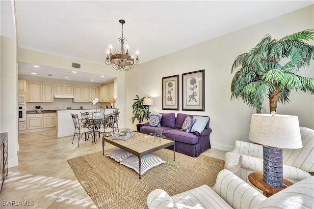 living room featuring a notable chandelier