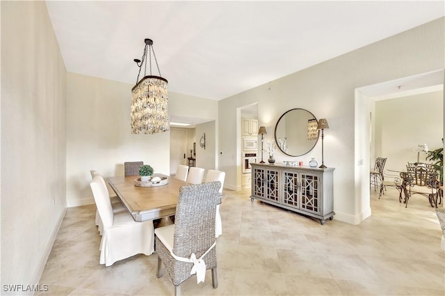 dining space featuring a chandelier