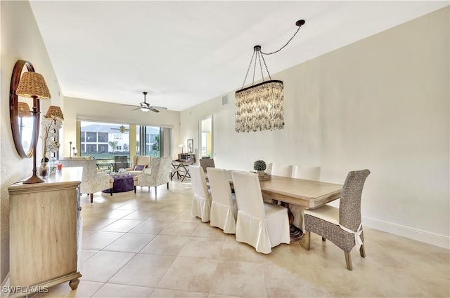 dining space with light tile patterned flooring and ceiling fan