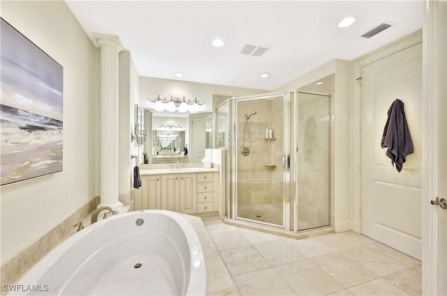 bathroom with vanity, decorative columns, and plus walk in shower