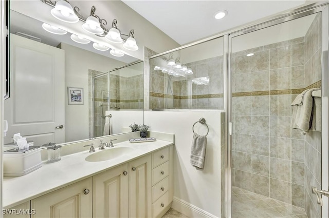 bathroom featuring an enclosed shower and vanity